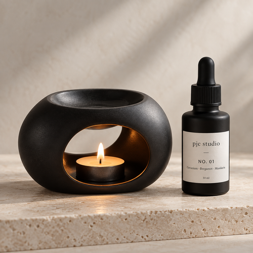 Matte black ceramic oil burner and No. 01 home fragrance oil from pjc studio