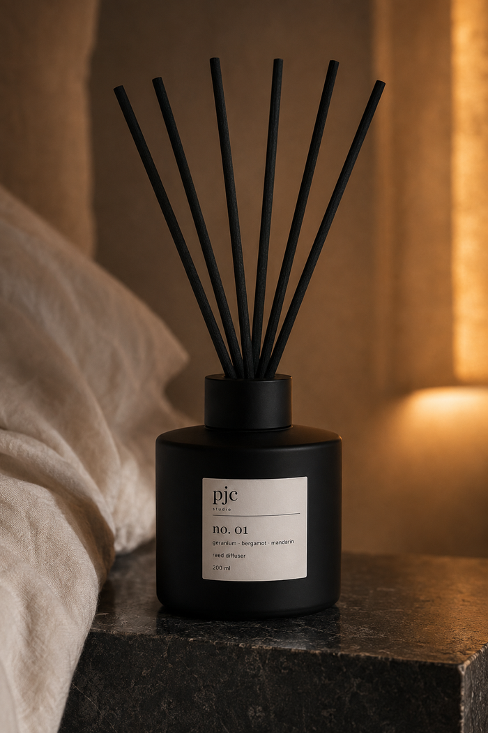 Matte black pjc studio No. 01 reed diffuser with black fibre reeds